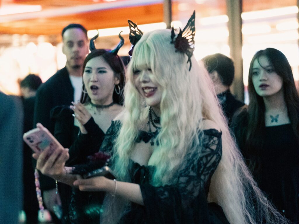 People wearing Halloween costumes on Hongdae Street in Seoul