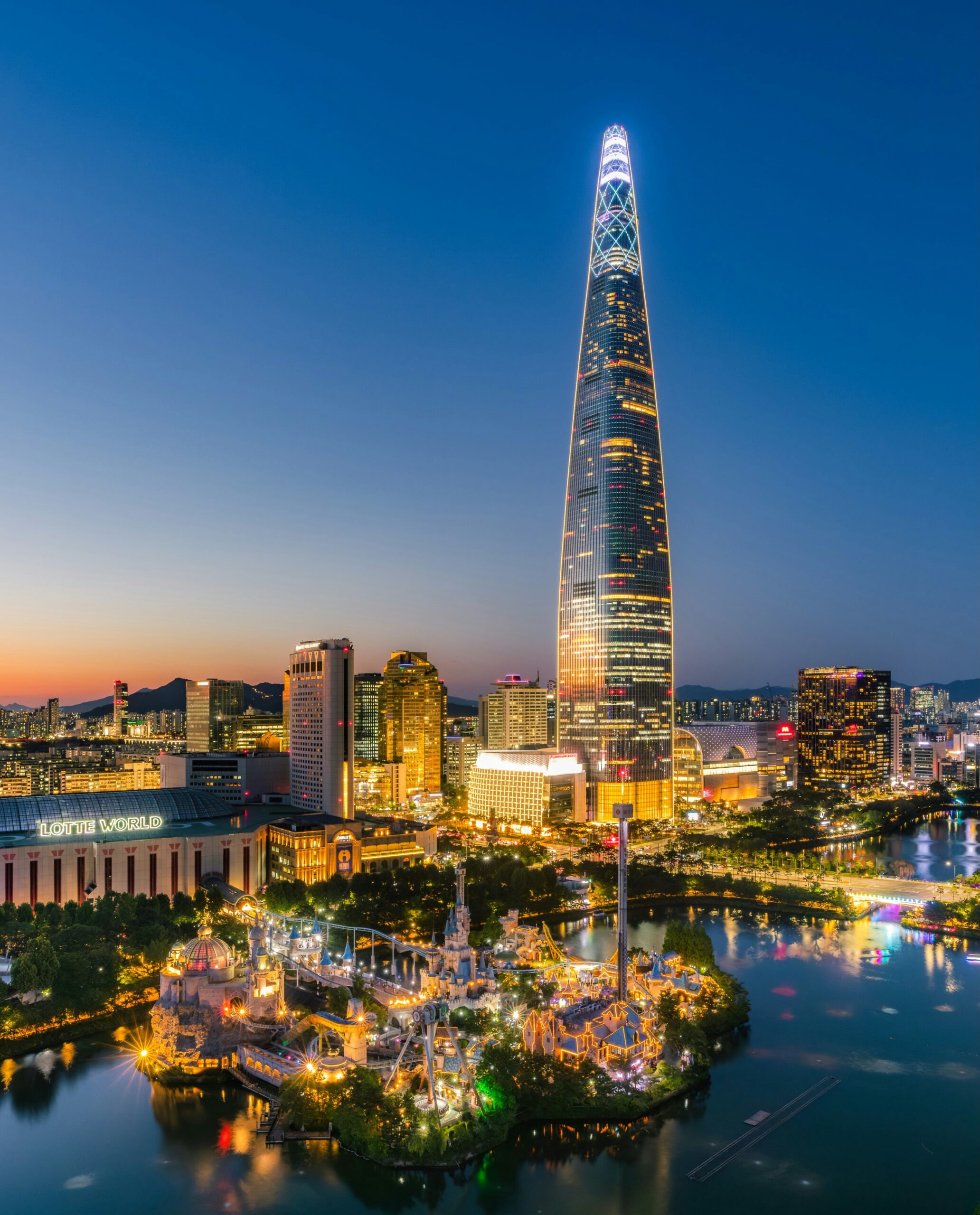 Lotte World Adventure and Lotte World Tower illuminated at night in Seoul