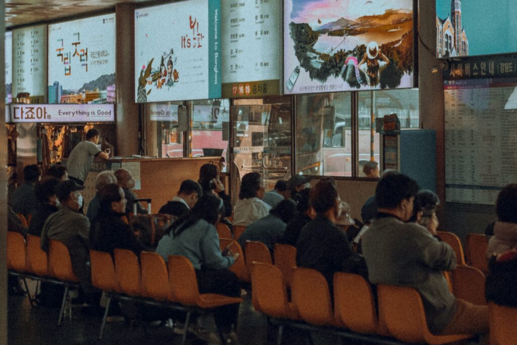 Passengers waiting inside a bus terminal in Seoul, South Korea