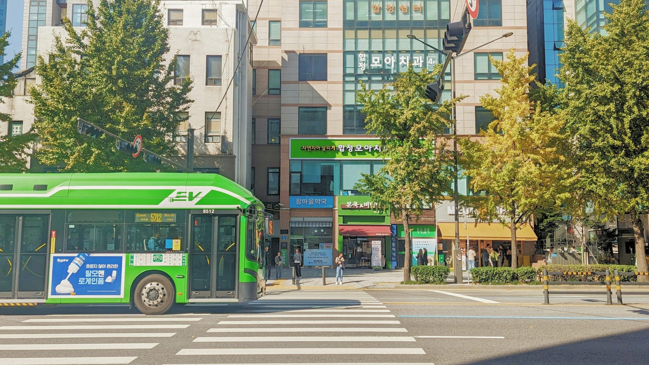 Green city bus on a street in Seoul, South Korea