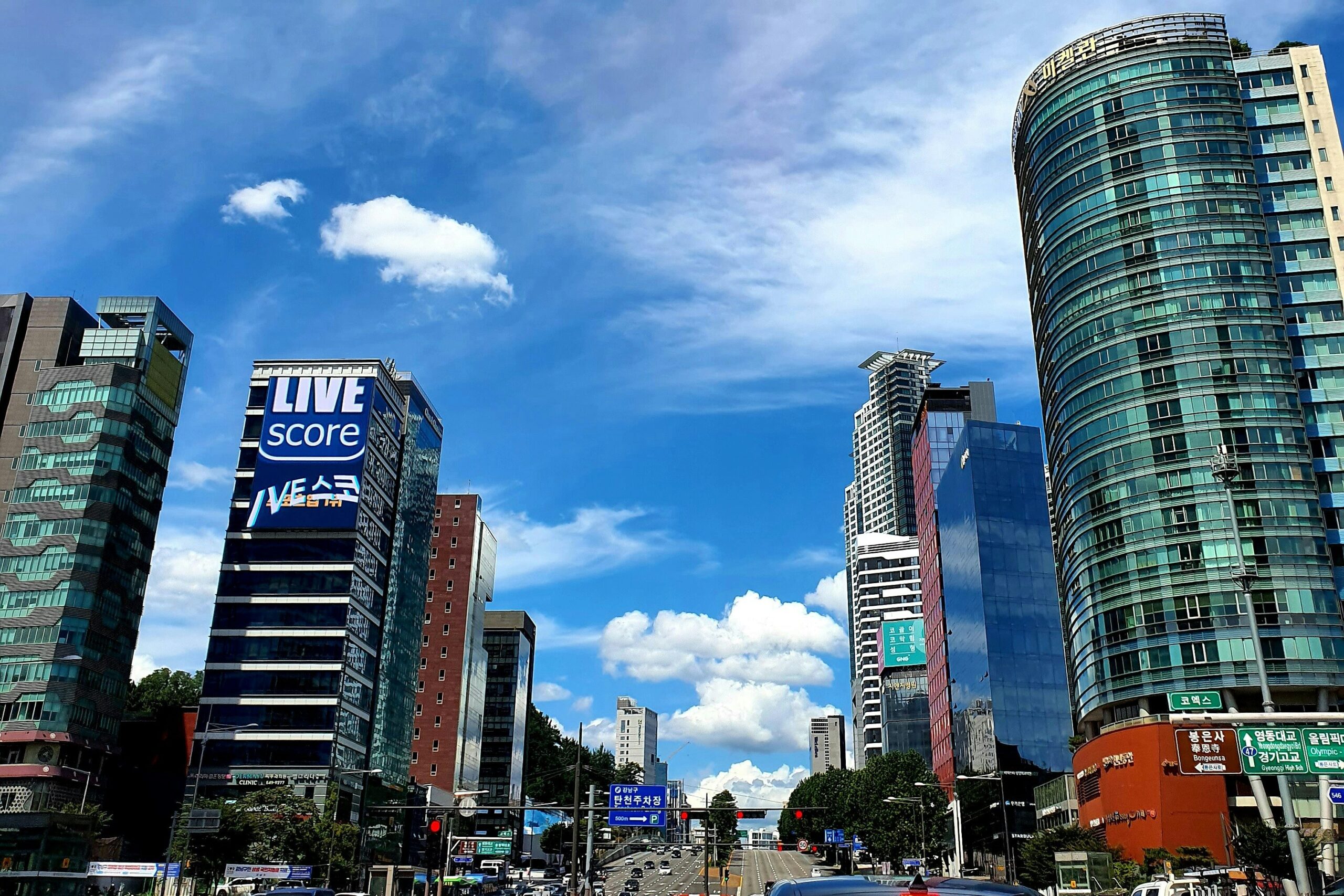 Wide road surrounded by high-rise buildings in Gangnam, Seoul